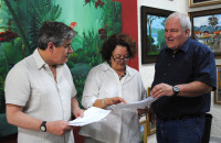 Staff discuss Haiti program needs in a temporary office space.