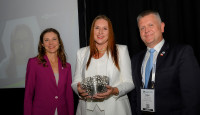 Carma Parrish (center) accepts a WOCCU 2022 Digital Growth Award on behalf of Northpark CCU
