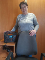 The chief accountant of Credit Union KhKVD in Kharkiv displays a power station purchased with WFCU grant dollars