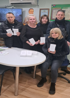 Employees of Credit Union Yednannia Cherez Pryrodnyi Zakon with their new power banks, Dnipro Oblast, Ukraine