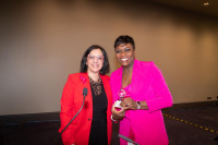 Eleni Giakoumopoulos (left) presents the 2021 Emerging Leader Award to Dayatra Matthews