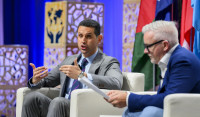 Abraham Tachjian (left) speaking to Jeff Guthrie at the 2023 World Credit Union Conference