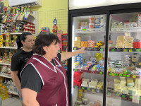 Khrystyna Romanovska and her mother in their grocery story showing new refrigerators, Lviv Oblast, Ukraine