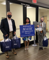 Dave Willis, TFCU EVP and COO (left), Kristy Viravong-Portis, TFCU AVP and manager of community engagement (center), and Mike Kloiber, TFCU president and CEO (right) deliver handmade masks to the Children’s Hospital at OU Medicine.