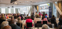 Nearly 200 attendees watch the We for She panel discussion at the GWLN Forum